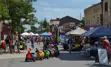 Kids on a miniature train at the Forest Farmers Market