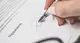 Person signing a form